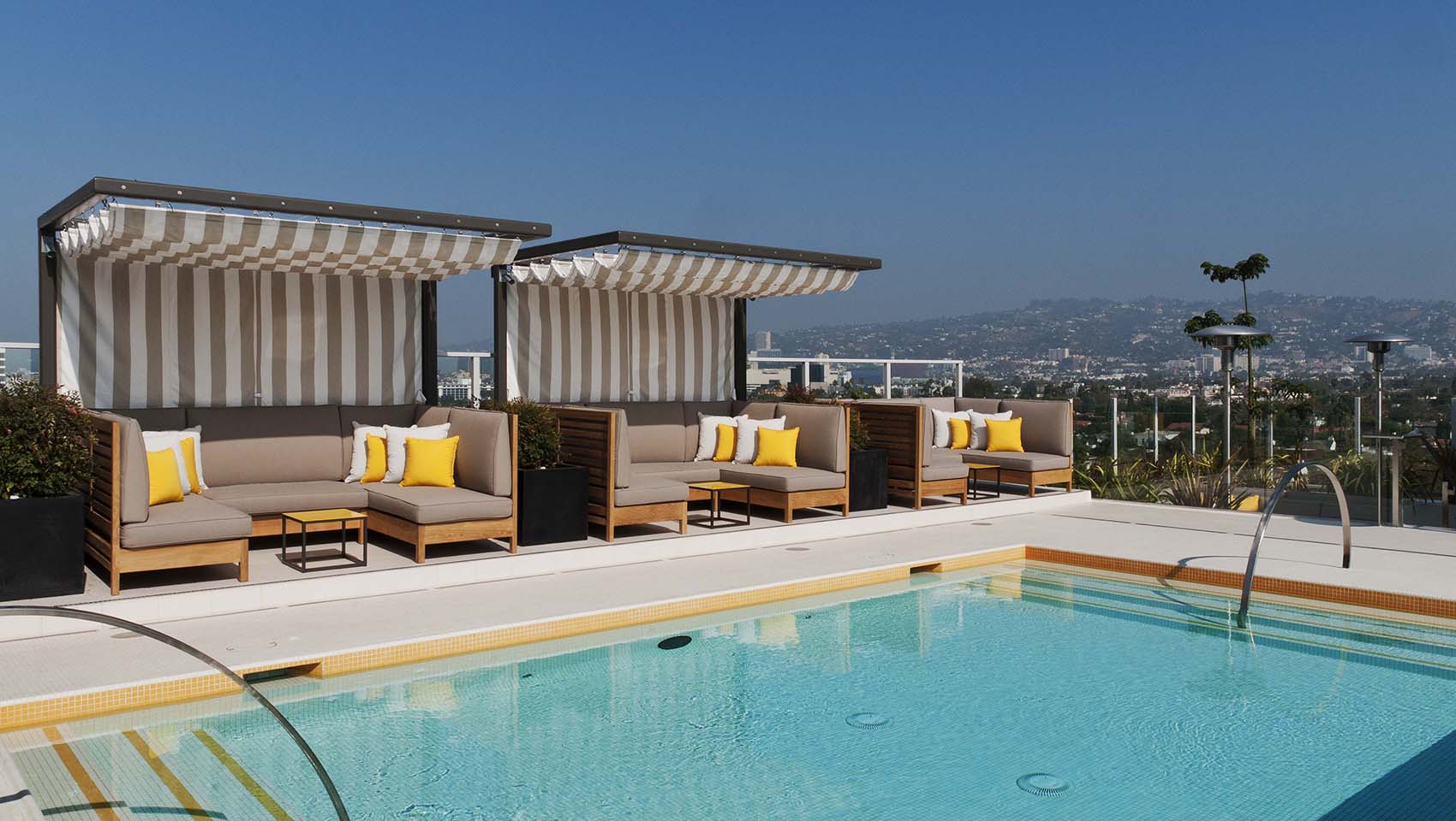 Kimpton Hotel Wilshire pool deck with lounge chairs