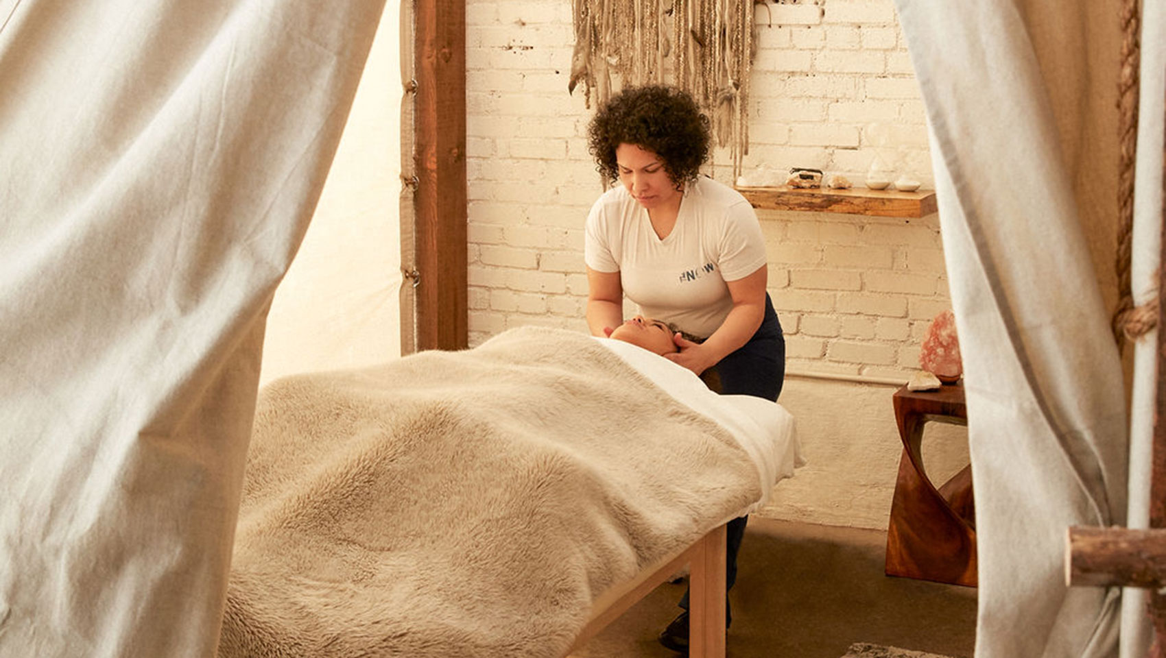 Massage therapist massaging client