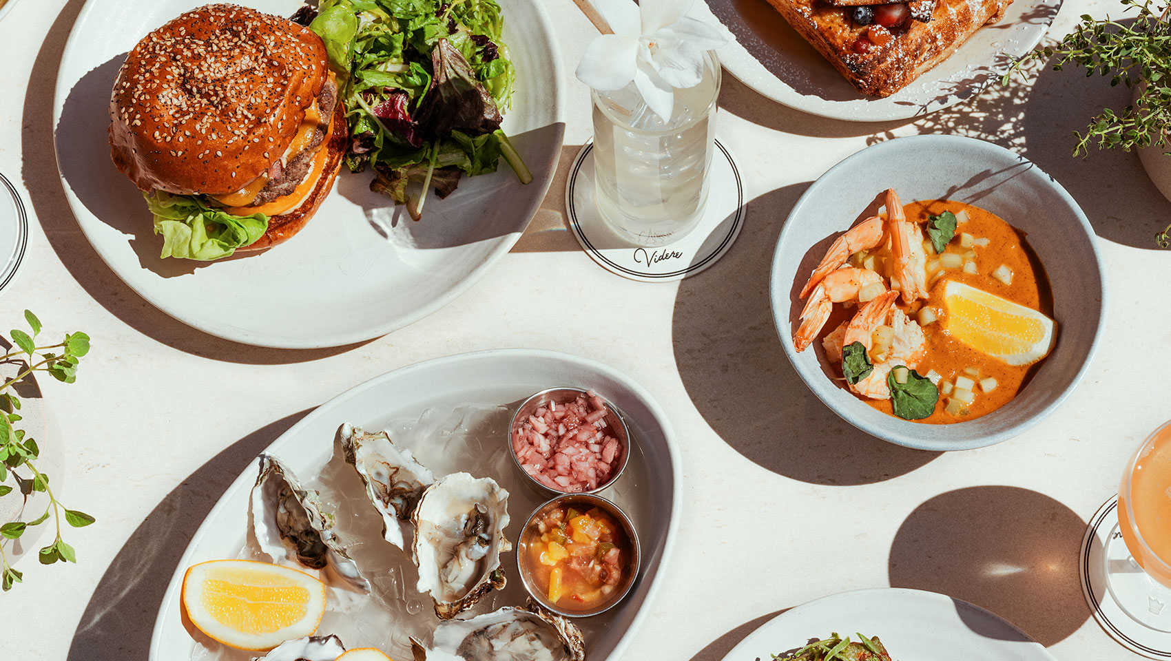 table spread with oysters, shrimp and burgers